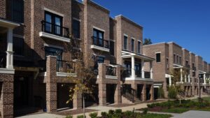 what should people consider while choosing between a townhouse and a multi unit apartment